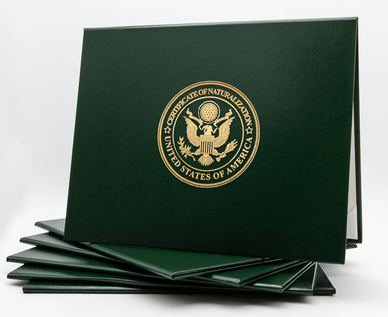 Green Honor U classic stock certificate of naturalization tent-style document cover with embossed detailing.
