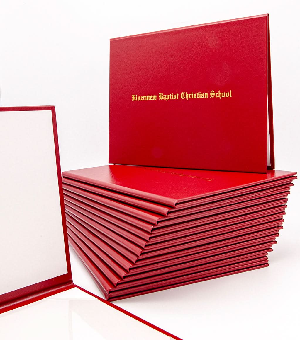 Custom tent-style document cover by Honor U with metallic foil printed text, shown with Riverview Baptist Group documents inside.