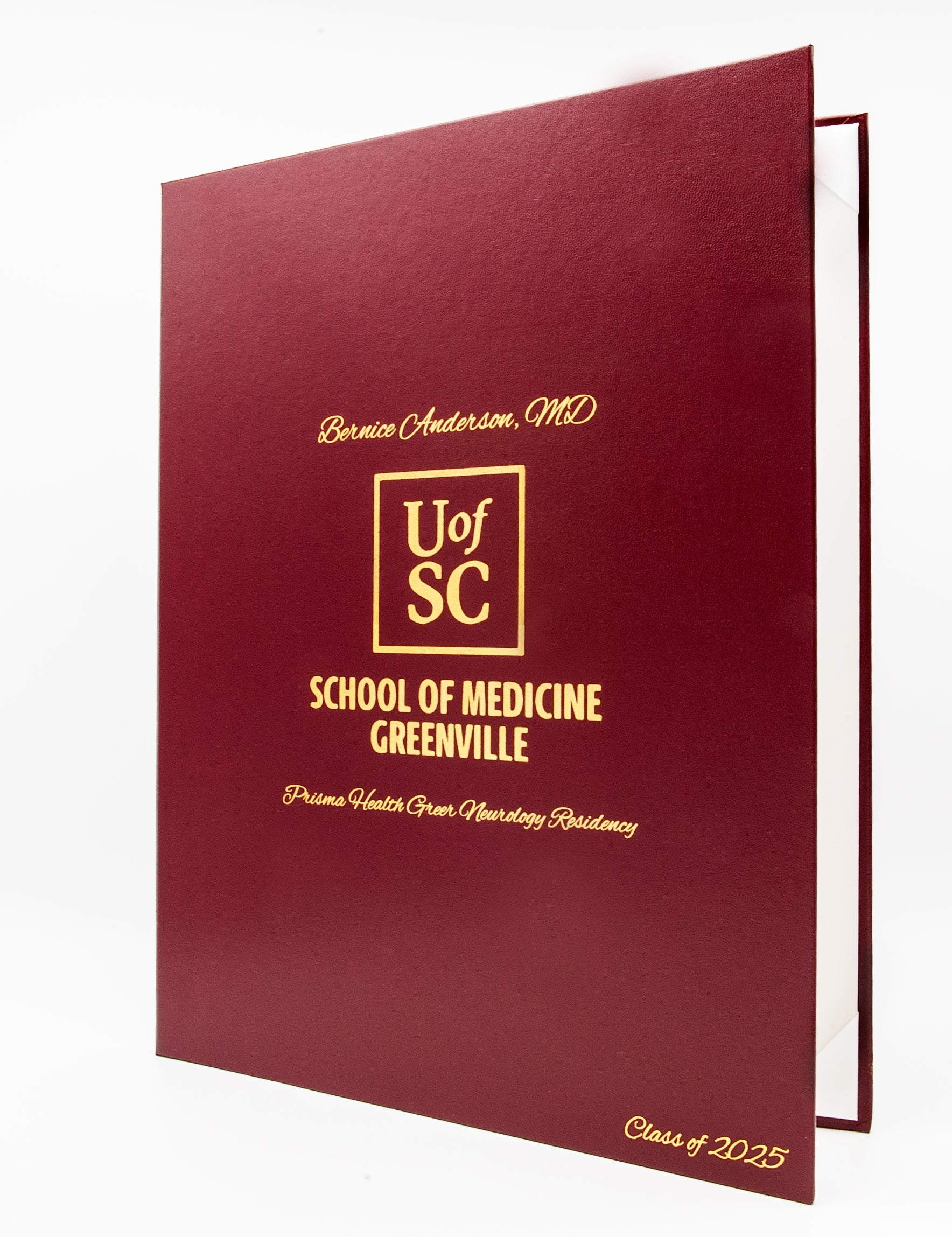 Maroon vertical orientated award case with gold text and UofSC logo on a white background