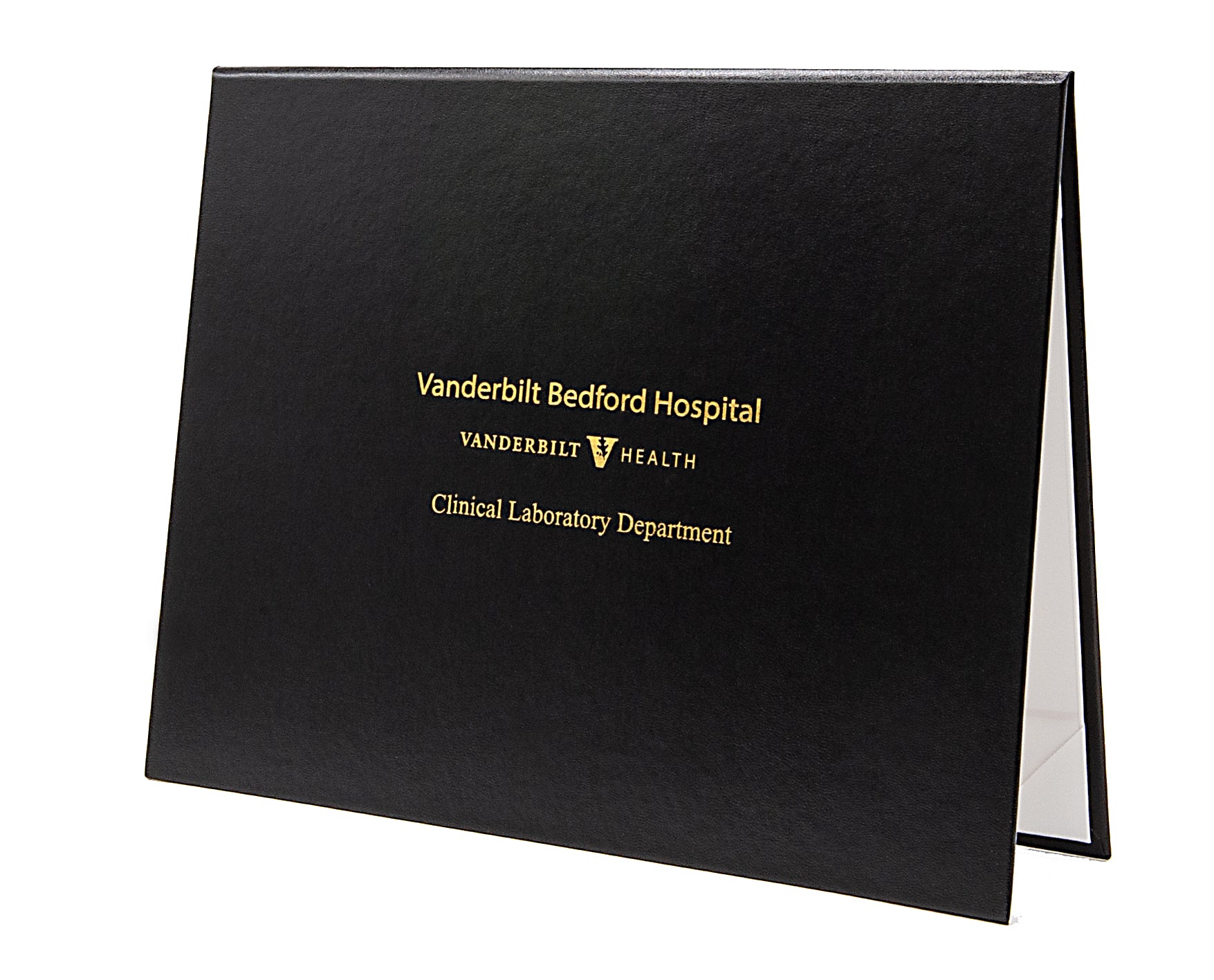 Black diploma cover with gold text and Vanderbilt Bedford Hospital logo on a white background